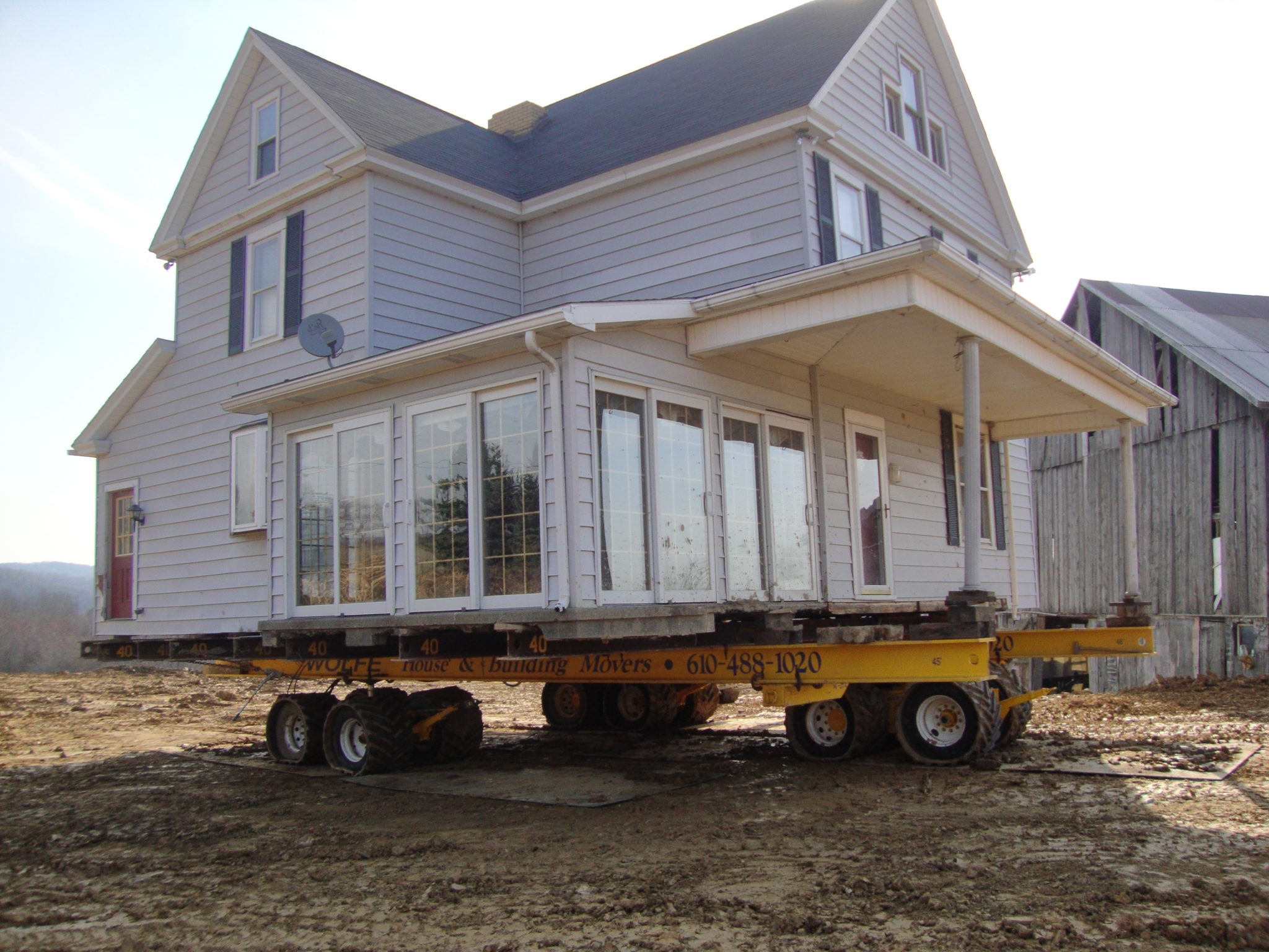 East Franklin two story home moving on dolly.