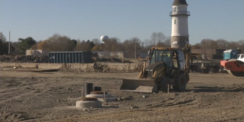 Skidsteer excavates job site in preparation to move Rhode Island Water Tower