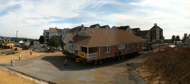 Single story house moving onto new location.