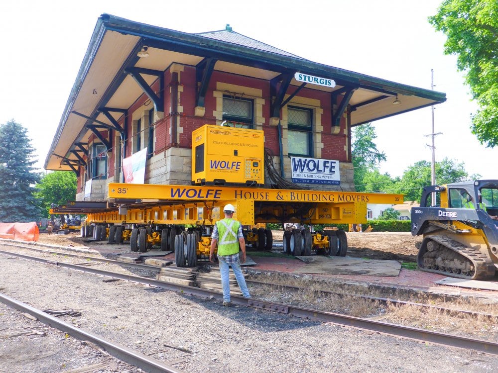 The Depot begins the first phase of the move at 4:00 PM. It travels at a snail’s pace so workers can place cribbing as it rolls.