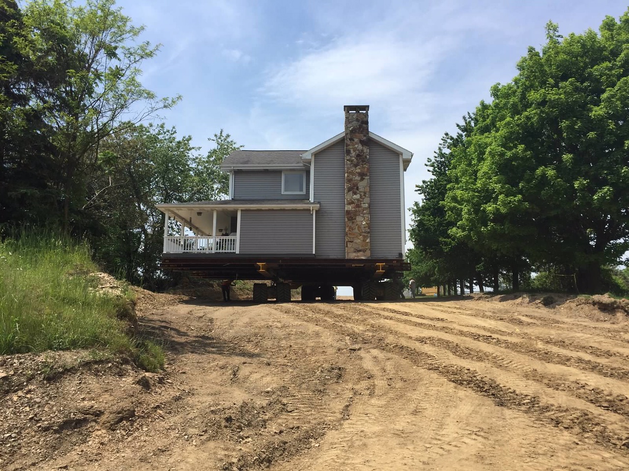 Farm House Moving on dolly on dirt road.