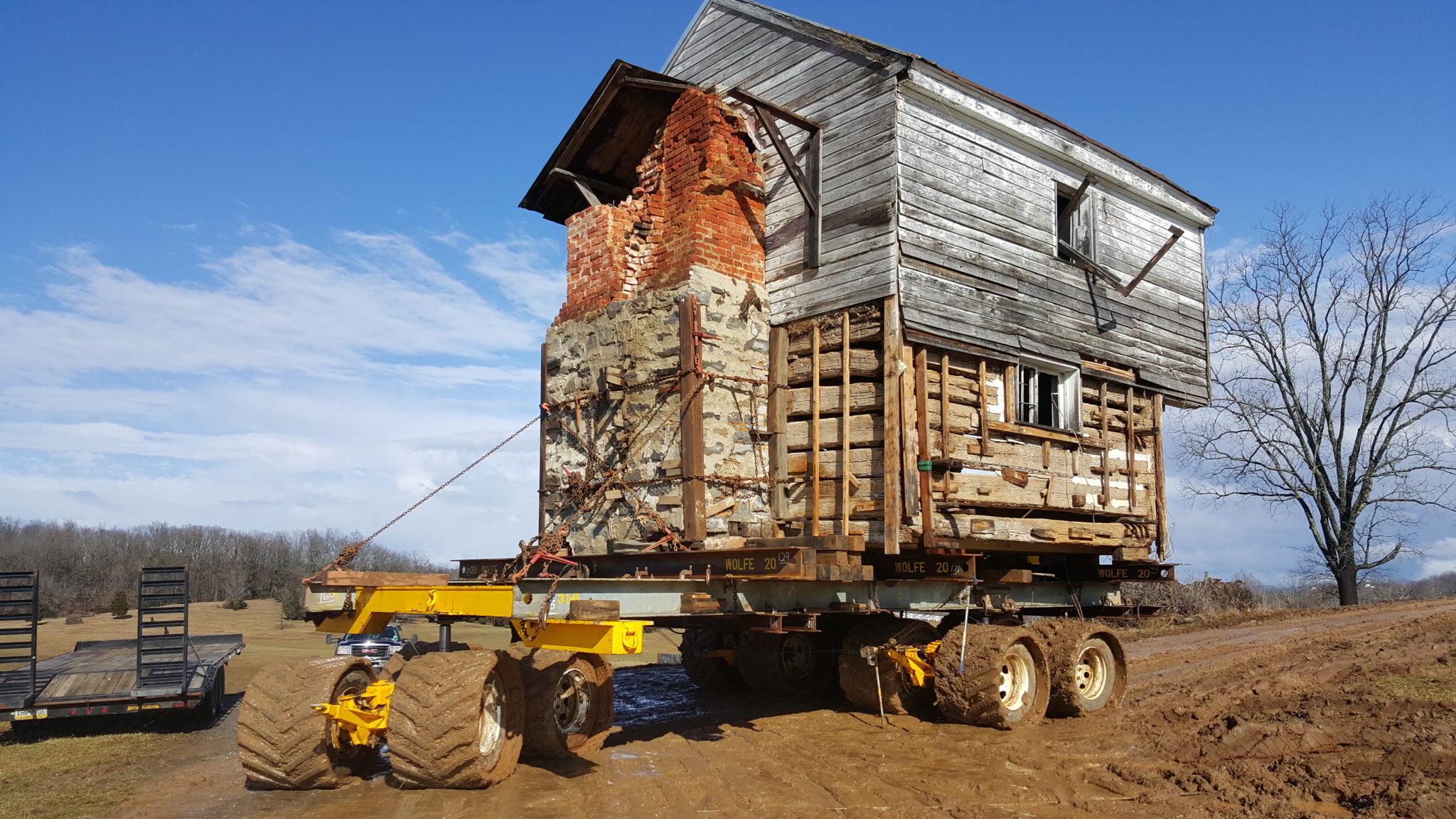 Slave Cabins moving on dolly through muddy conditions in fall time.