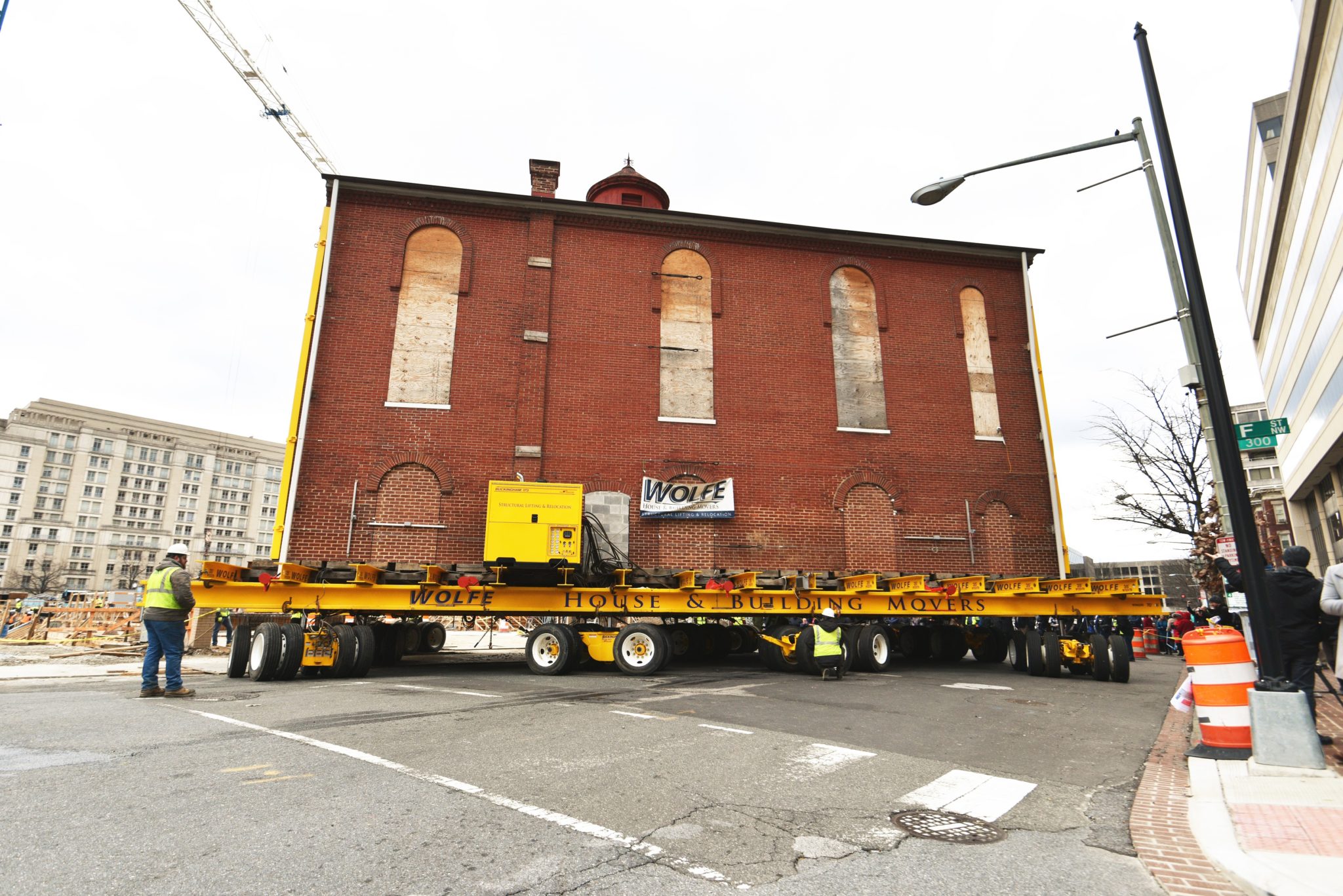 Side view of Jewish historic synagogue moving on turning dolly.