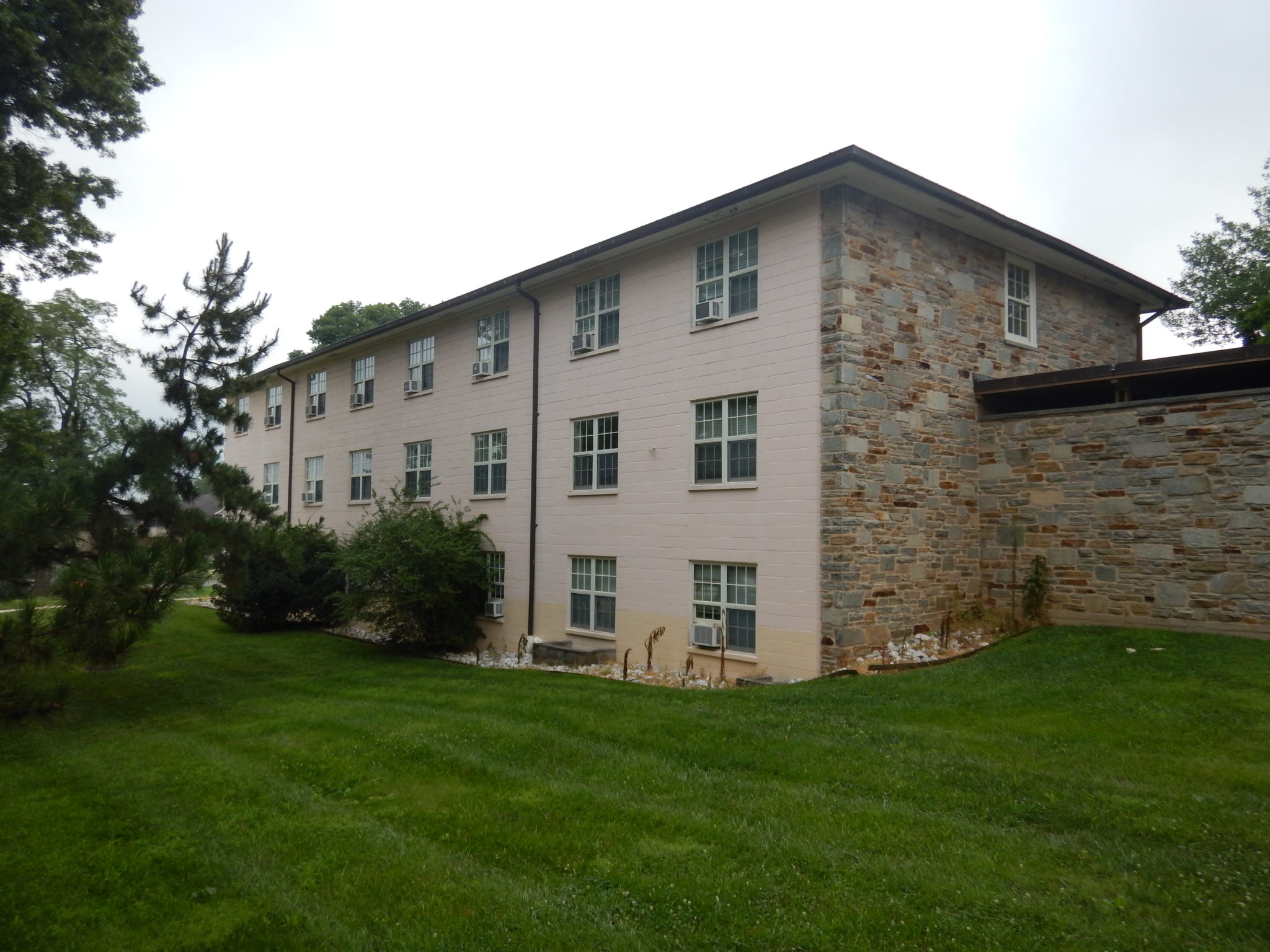 Goucher College Dorm, a cinder block and rough stone building.