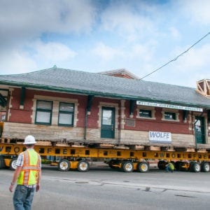 Sturgis Railroad depot, on a dolly, moving turning through a city street.