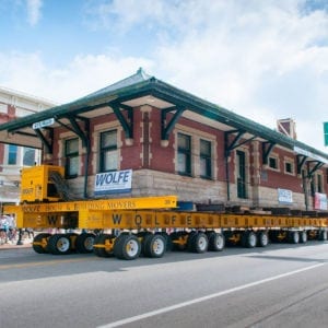 Sturgis Depot being transported on dolly through street of small town.