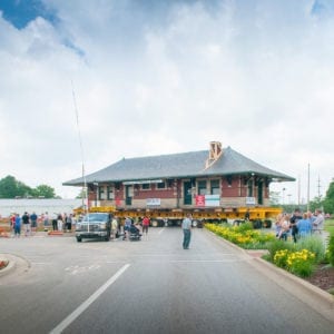 Sturgis Railroad depot, on a dolly, turning off of a boulevard.