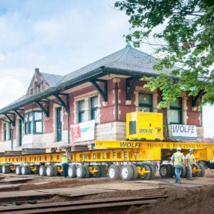 Sturgis Railroad depot on dolly pulling up to new foundation.