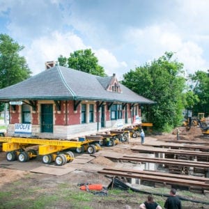 Depot on dolly moving onto its new foundation.