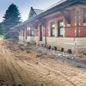 Sturgis Railroad depot foundation with evenly spaced holes purposefully placed along the foundation.