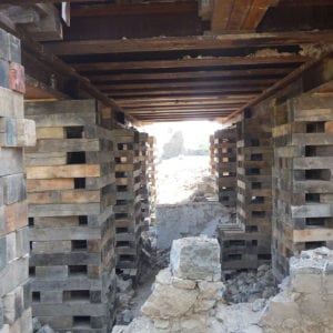 Wooden supports under steel beams.