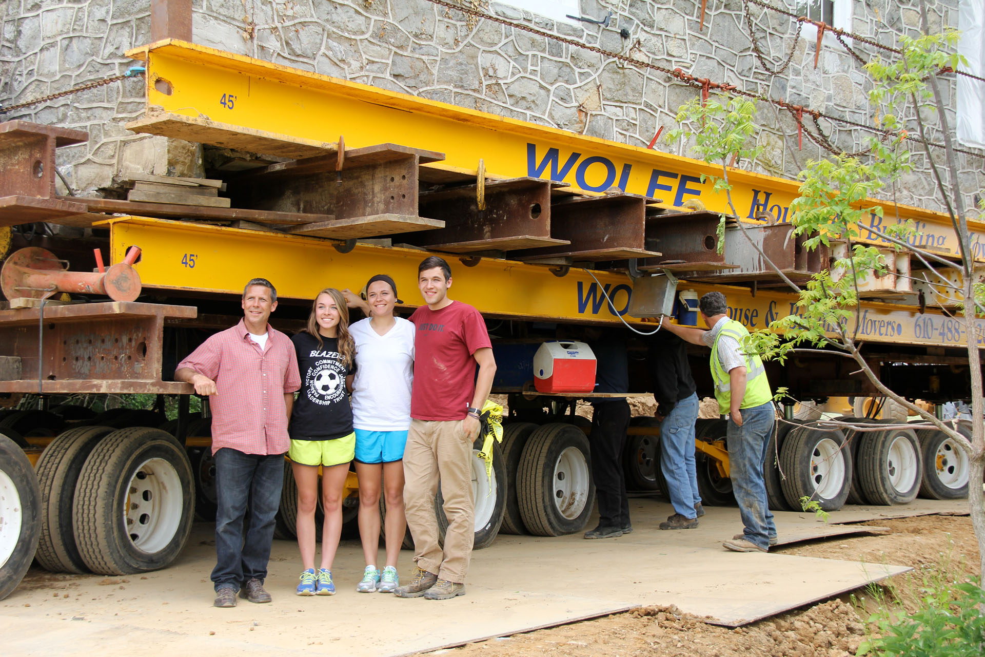 Ashley family next to landisville stone house on dolly.