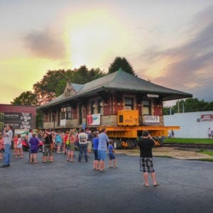 Sturgis Railroad Depot moving on dolly at sunset.