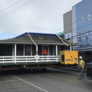 Wrightsville-beach-cottage-on dolly moving through street.