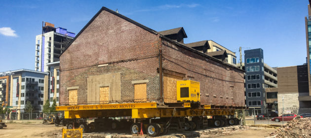 Historic Livery Building Relocation raised on dolly.
