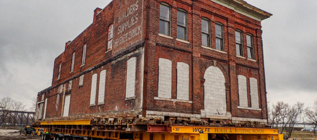 Corner view of historic brick building on dolly.