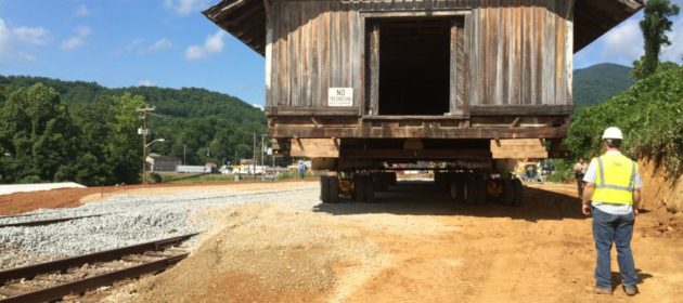 Boone's mill moving on dolly as worker inspects its sureness.