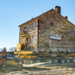 Enola Miller House with skid steers