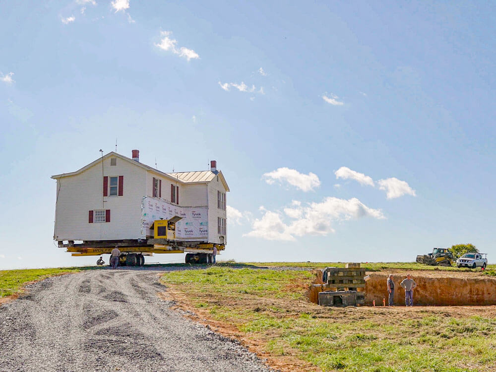 Virginia farmhouse coming down the hill to its new location
