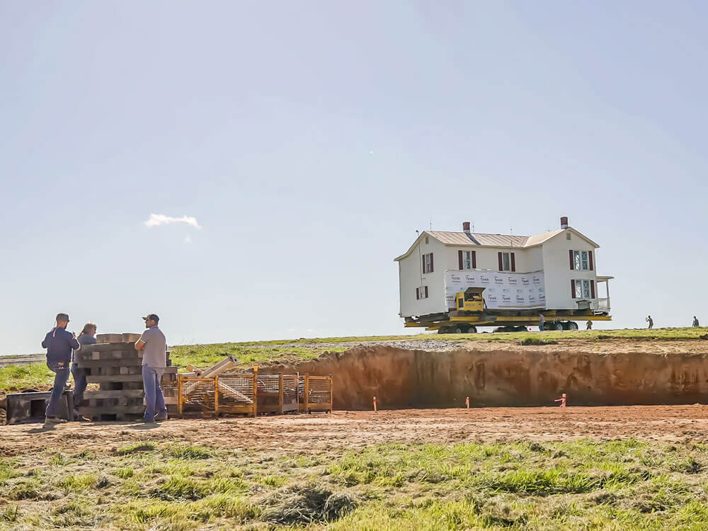 Virginia farmhouse coming across hill to new location