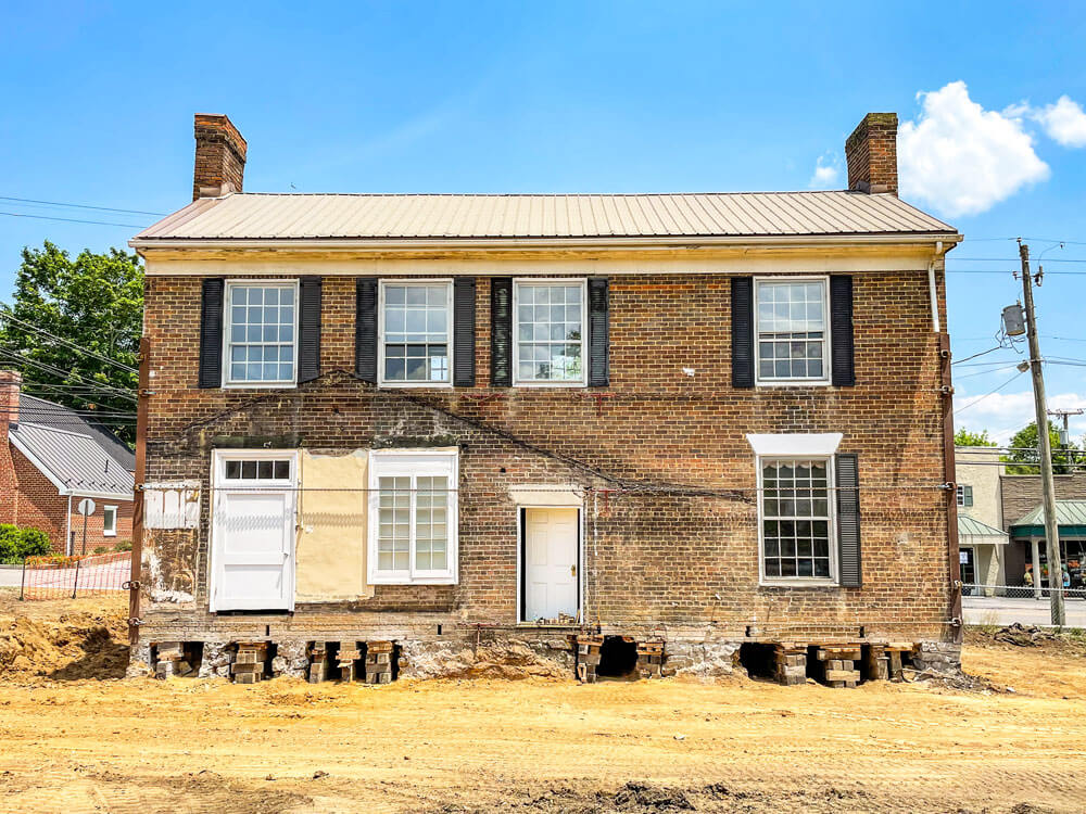 Dooley House with foundation holes for steel beams