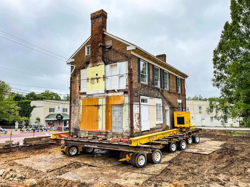 Dooley House moves over steel plate to new location