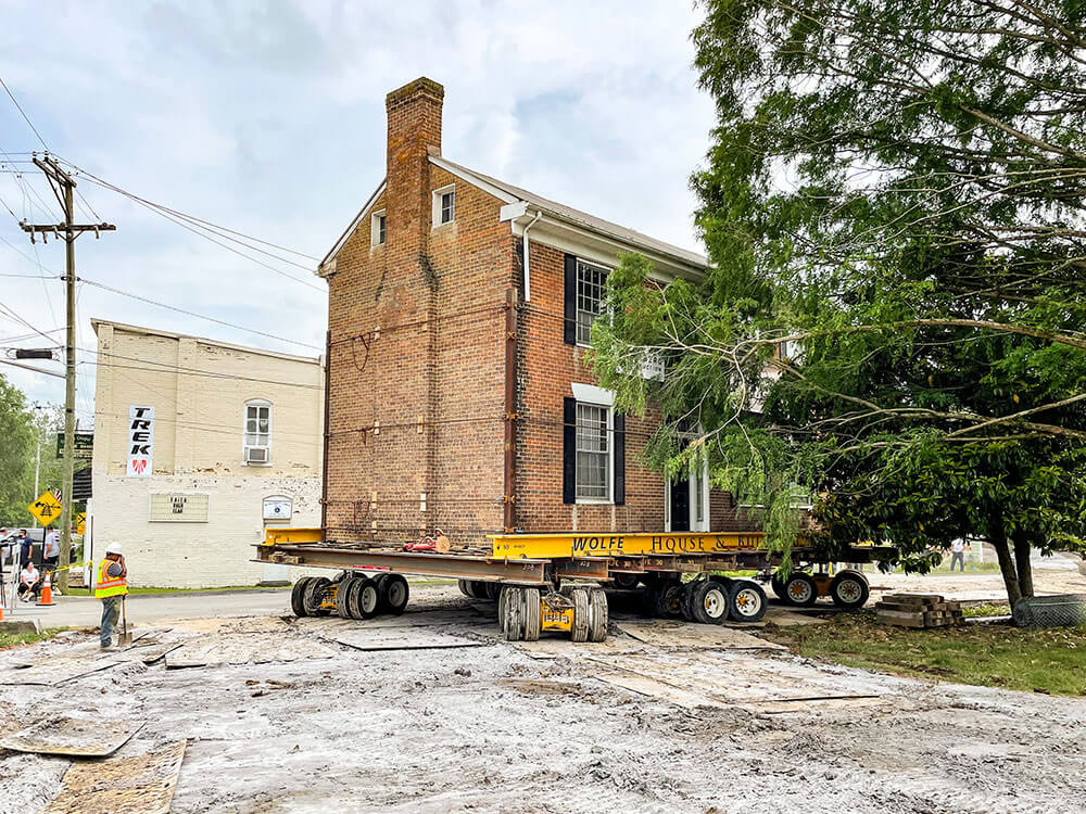 Dooley House rounds corner in move route