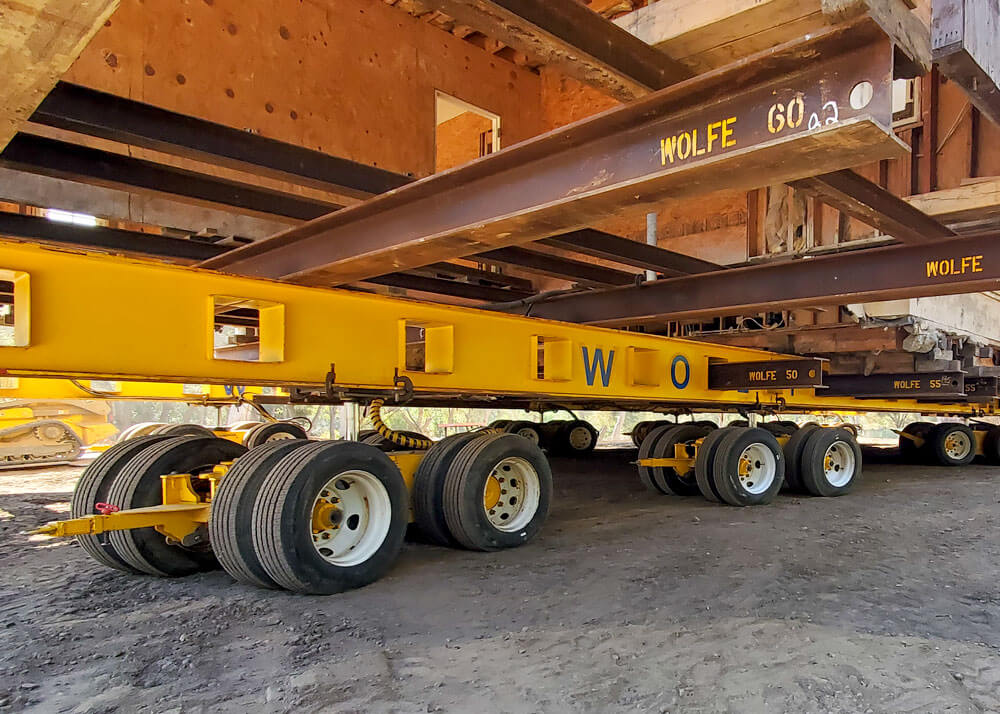 Steel beams and dollies under a Montecito home  that is being relocated