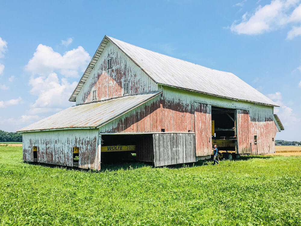 Apple barn being relocated through field