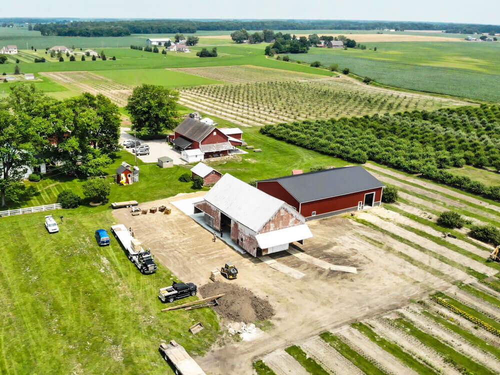 Apple barn being driven over new concrete slab