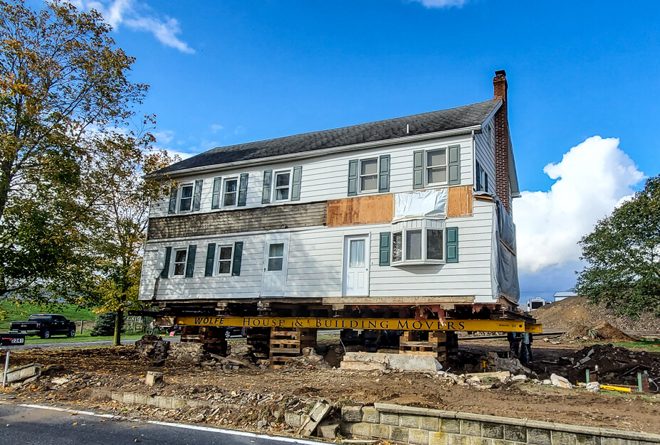 Frame Farmhouse Sitting on Steel 