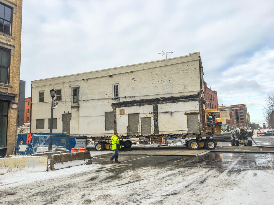 a large brick building is moved into the street