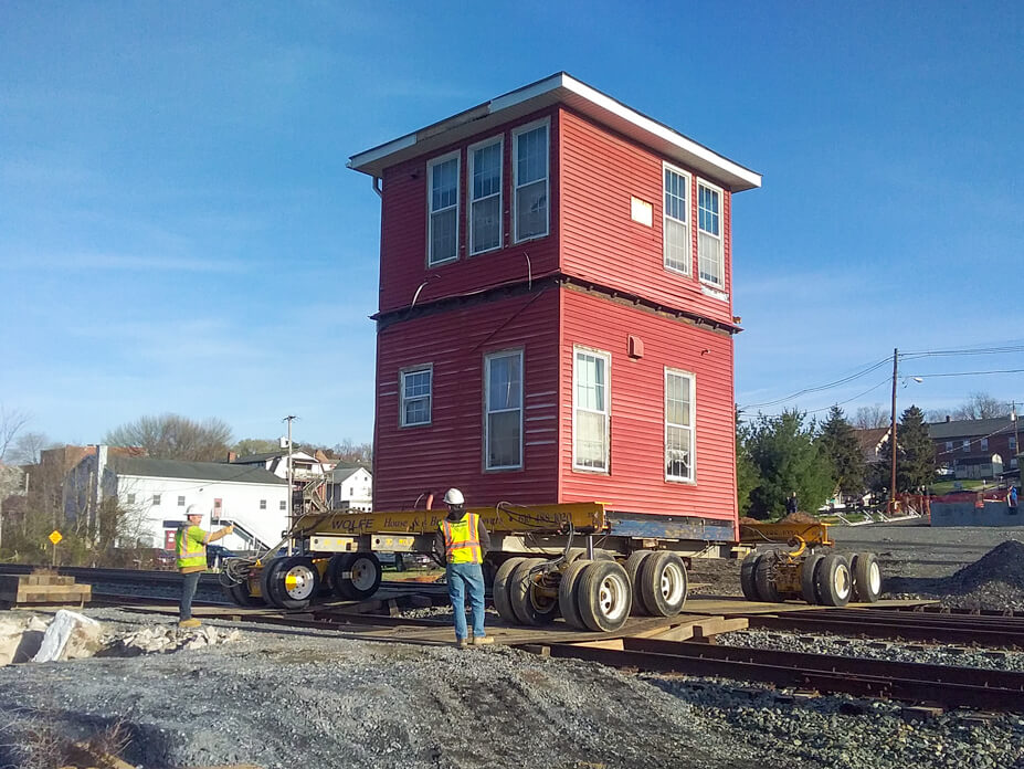 Foreman drives Brunswick rail tower across train tracks