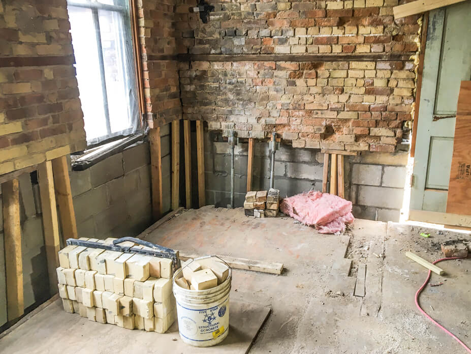 Foundation blocks under a supported brick wall