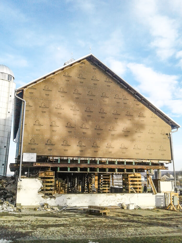 End view of crib piles under timber frame barn