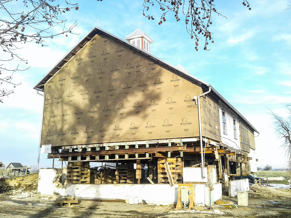 Timber frame barn with crib piles under it
