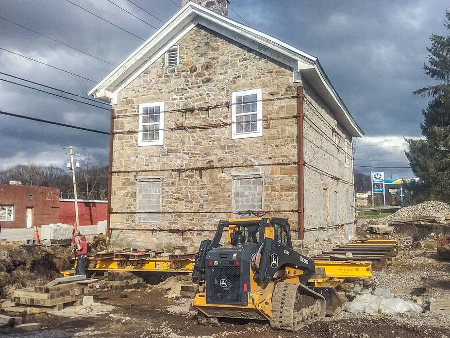 Wolfe installs steel beams under stone house