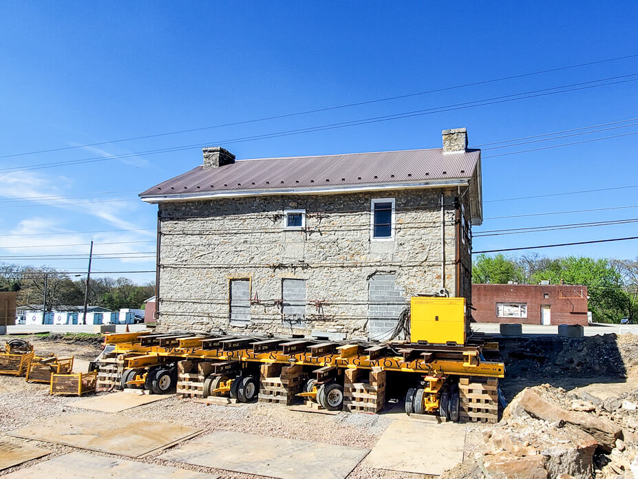 Stone house on beams and cribbing