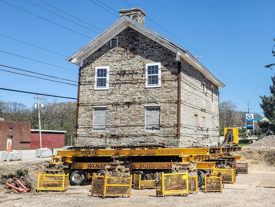 Stone house sits on steel beams and dollies