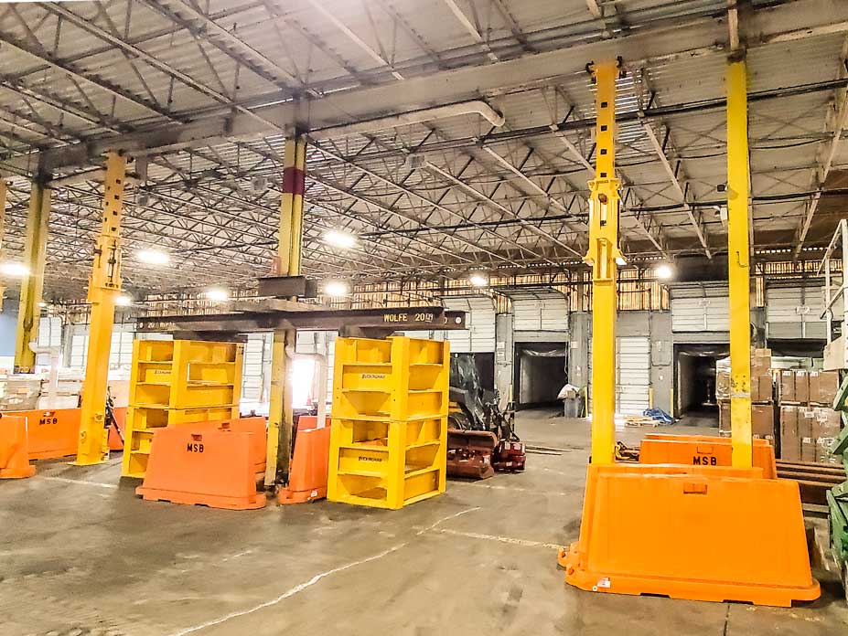 Wolfe uses custom shoring stands and column jacks to support warehouse roof