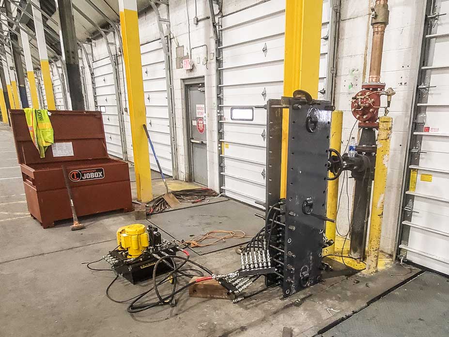 Wolfe uses a custom hydraulic press to straighten the column flanges