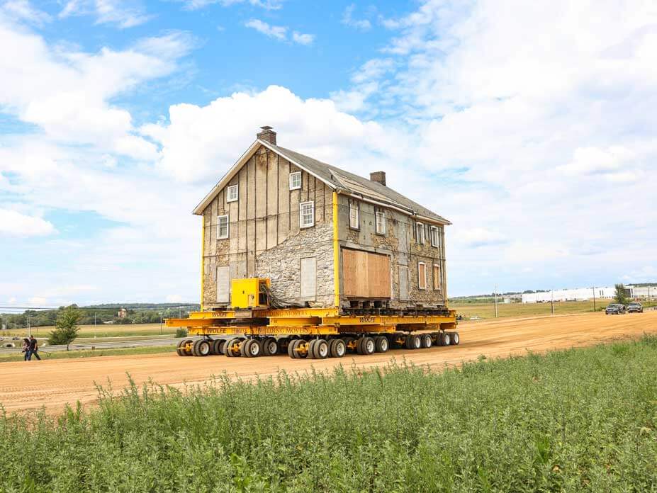 2-story stone house rolls along move path