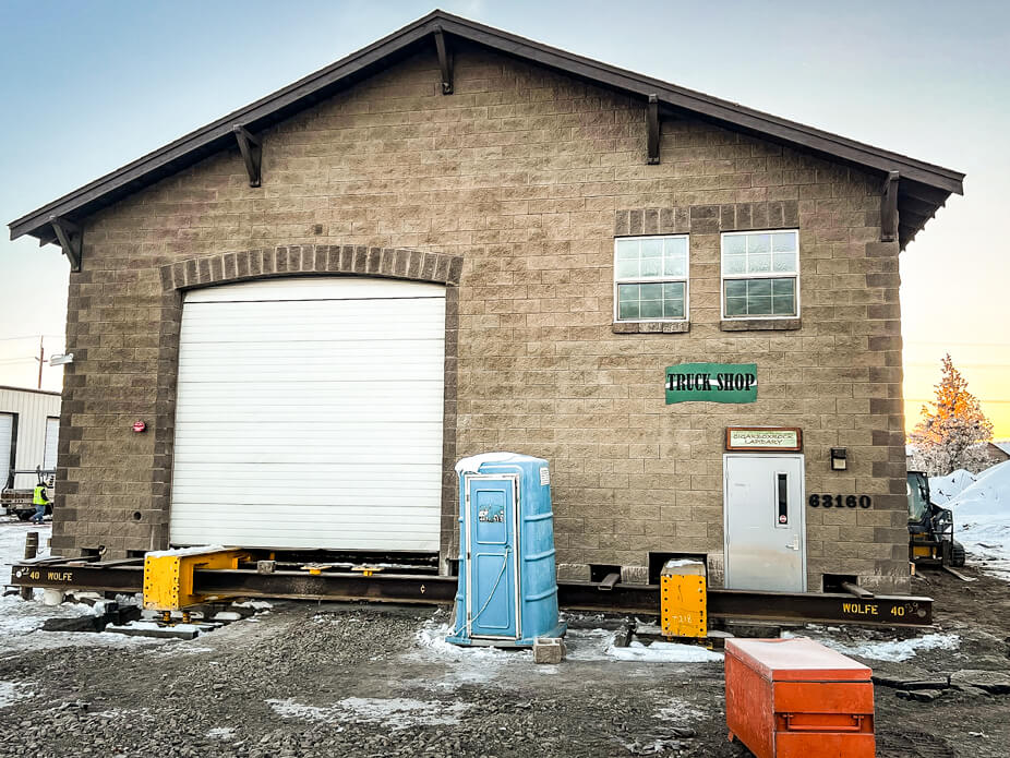 Wolfe inserts steel beams under masonry building in preparation for move