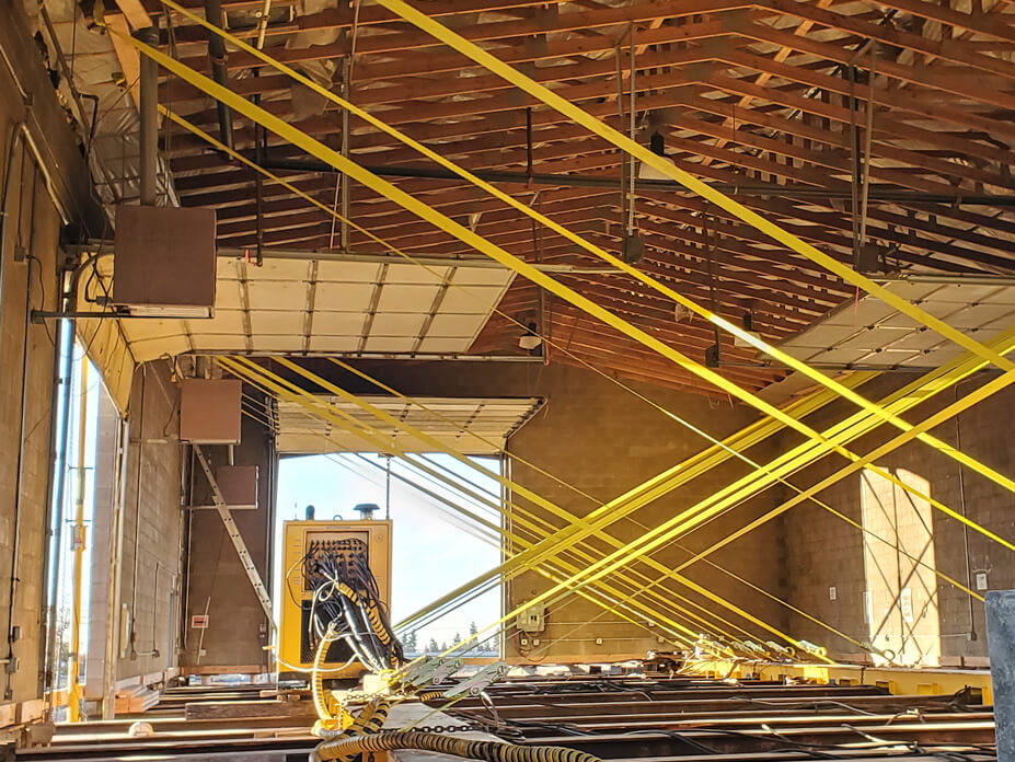 Cross bracing inside of masonry building prepped for relocation