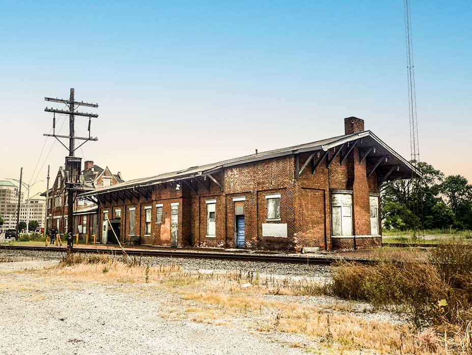 The circa-1860s brick Hamilton Depot in its original location beside the tracks