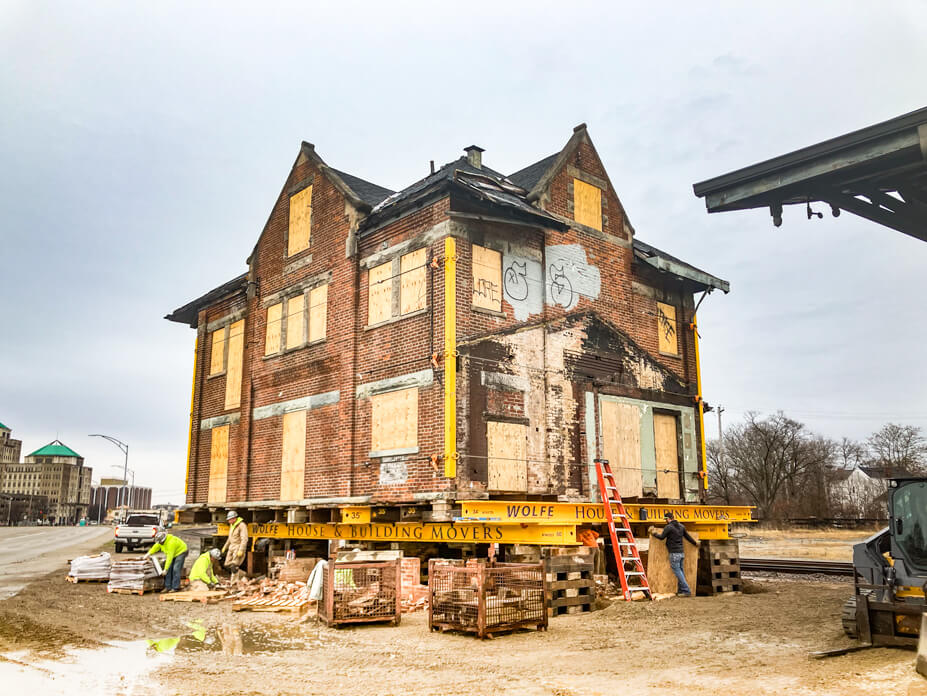 Wolfe workers install steel beams and cribbing under the Hamilton Depot