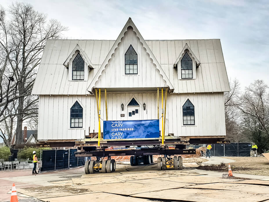 Wolfe drives the Ivey-Ellington House over steel plate to its new foundation