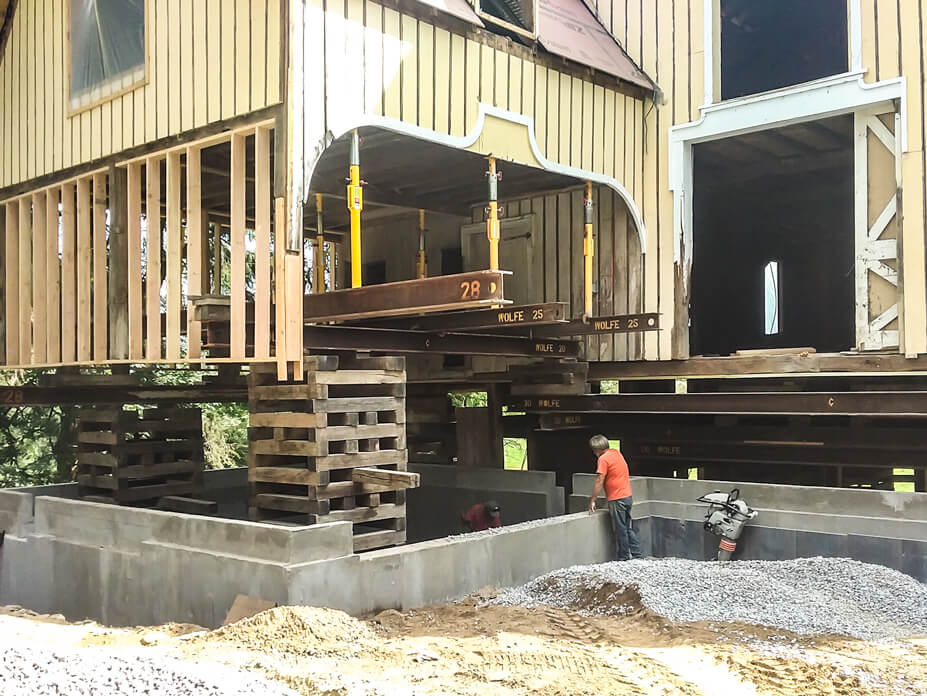 Buckingham jacking-shoring posts support interior beams during a barn lift