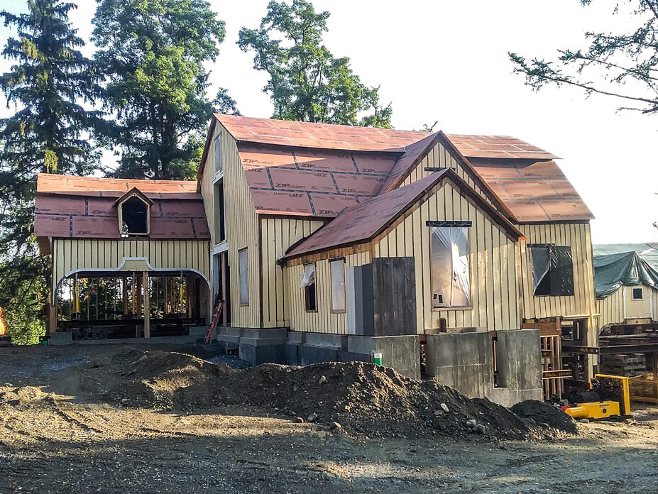 Wolfe sets an 111' barn onto its new foundation walls