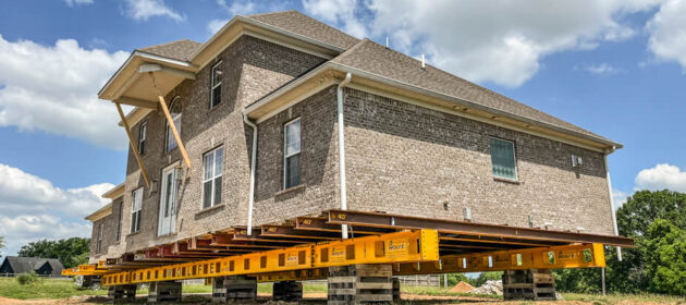 2-story brick veneer house sits on steel beams and cribbing